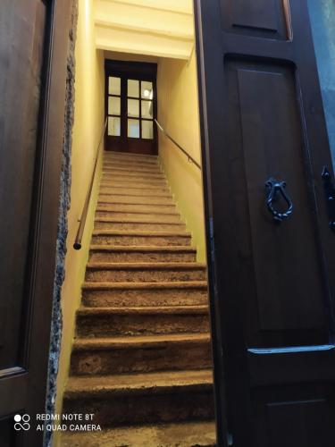 a set of stairs leading up to a door at Appartamenti a Pitigliano in Pitigliano