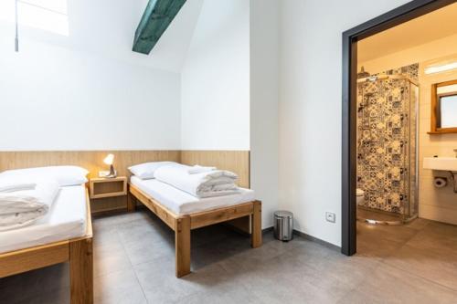 Postel nebo postele na pokoji v ubytování Penzion na Vinařství