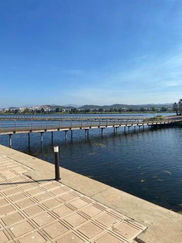 a dock in the water next to a body of water at Luxueux appartement Ritz Carlton Marina Smir in Sania Torres