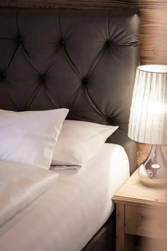 Postel nebo postele na pokoji v ubytování Residence Cesa Sassela