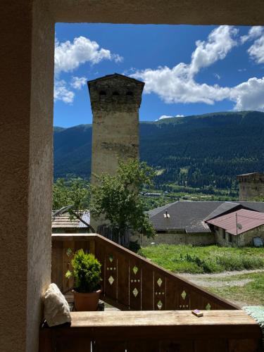 a view from the balcony of a building with a tower at Lanchvali Inn in Mestia