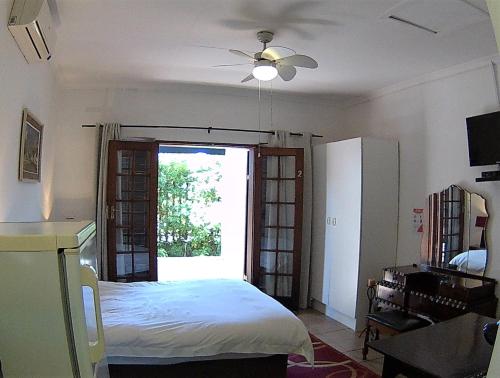 Postel nebo postele na pokoji v ubytování Kuru-Kuru Guesthouse