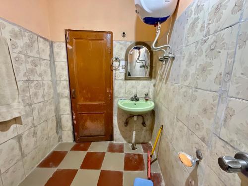a bathroom with a sink and a toilet and a balloon at MOUNTAIN HOME STAY -RANG, at Reckong Peo - Kalpa, Near Goyal Motors, Way to Petrol Pump at ITBP Quarters in Kalpa
