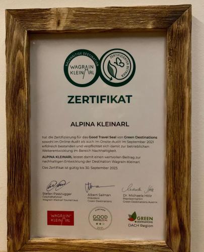 a framed diploma sign in a wooden frame at Hotel Alpina in Kleinarl