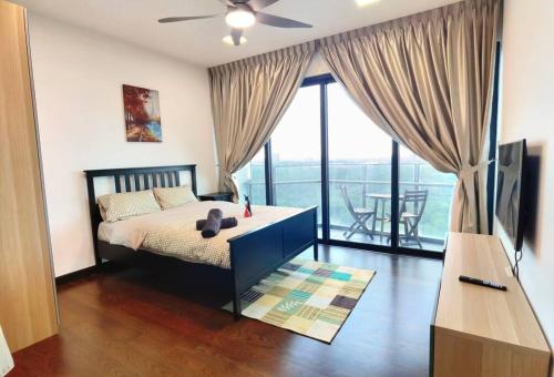 a bedroom with a bed and a large window at Almas Family Studio 100mbps Netflix By STAY in Nusajaya