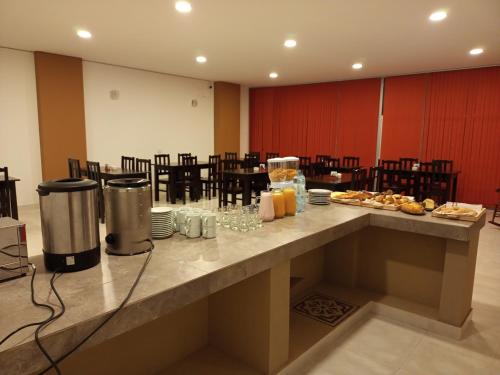 a table in a room with food on it at Parque Hotel in San Salvador de Jujuy
