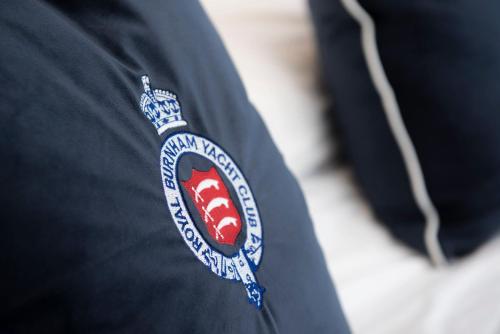 a close up of a patch on a persons shirt at The Royal Burnham Yacht Club in Burnham on Crouch