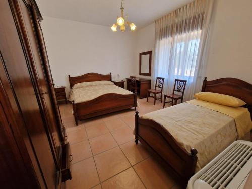 En eller flere senge i et værelse på L'Antica Casa Affittacamere