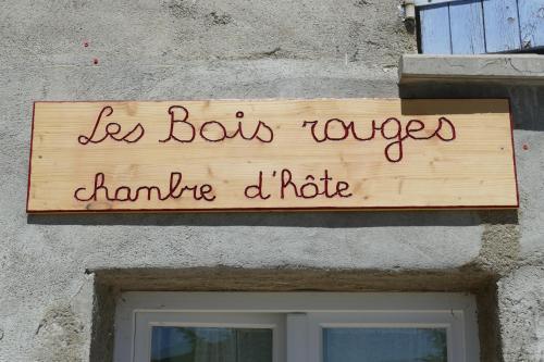 a sign on a building that reads be bots tongueampirehibited hate at Les bois rouges in La Rochegiron