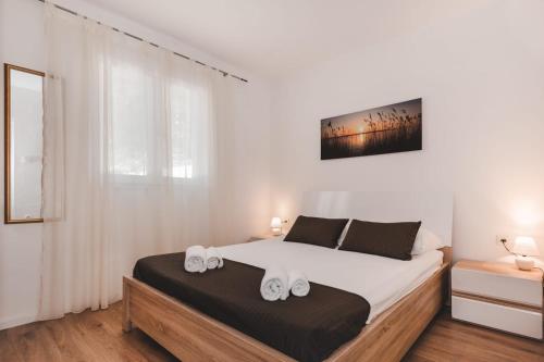 Ένα ή περισσότερα κρεβάτια σε δωμάτιο στο Apartman Luka