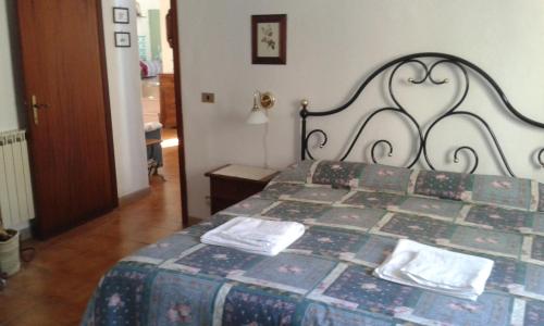 Ένα ή περισσότερα κρεβάτια σε δωμάτιο στο Casa dei Lavatoi Pitigliano