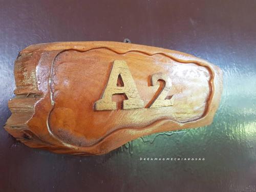 a wooden object with the letters a and z on it at Dreamhome Chiangdao in Chiang Dao