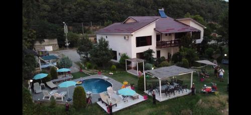 an aerial view of a house with a swimming pool at CHALET Orsova in Orşova