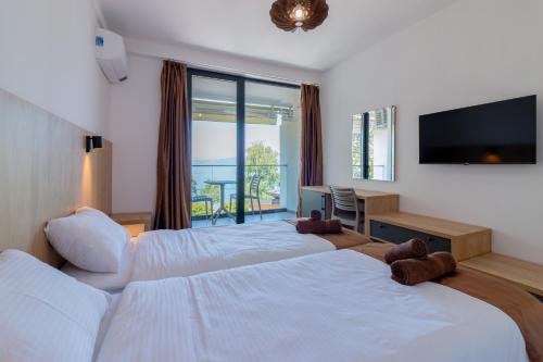 Cama o camas de una habitación en Lago Hotel