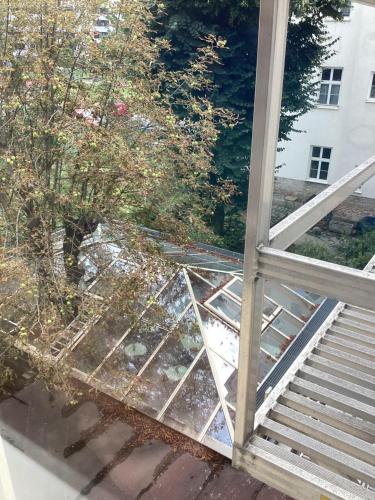 a balcony with a glass railing and a stair case at Hotel Pribitzer in Vienna