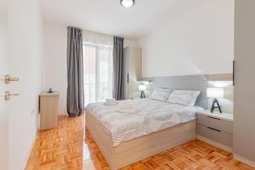 Ліжко або ліжка в номері K&F Apartments