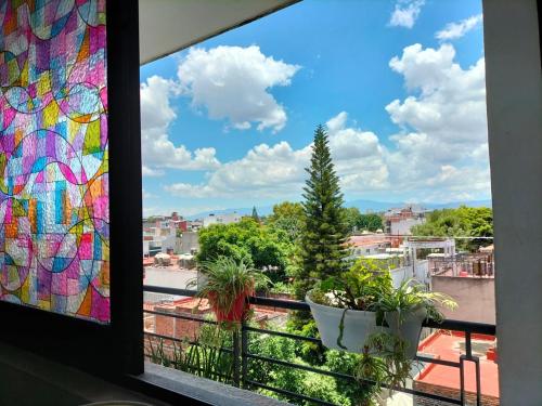a window with a view of a city at Departamento COMPARTIDO en el Corazón de la Ciudad in Mexico City