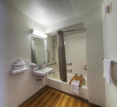 a bathroom with a sink and a shower at Motel 6-Orlando, FL - Winter Park in Orlando