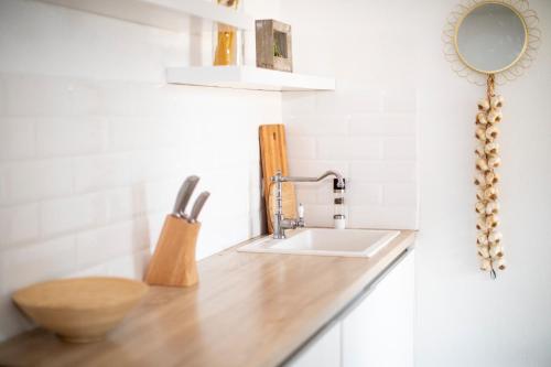 a bathroom counter with a sink and a mirror at Villa Marleku in Pakoštane