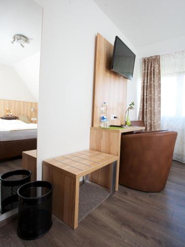 TV a/nebo společenská místnost v ubytování Hotel Reinhardtshof Garni