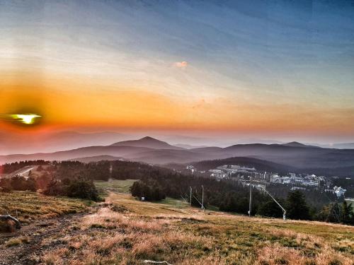 a view of a mountain with a city in the distance at Milmari S70 Kopaonik in Kopaonik