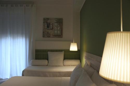 Katil atau katil-katil dalam bilik di B&B Medinblu
