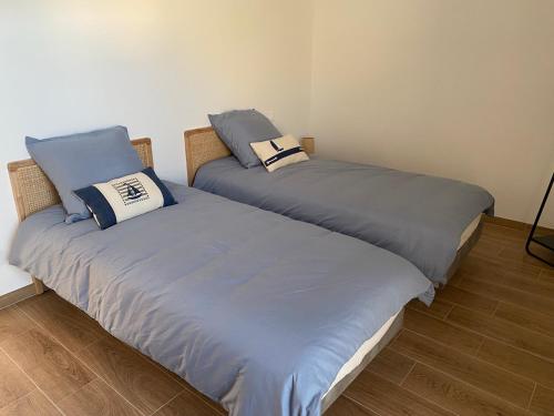 En eller flere senge i et værelse på Le Clos des Embruns