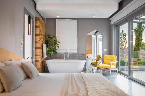 Postel nebo postele na pokoji v ubytování Daluz Boutique Hotel