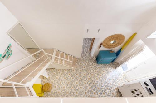 an overhead view of a room with stairs and a tub at Casa Gastronomo in Procida