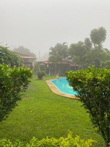 a swimming pool in the yard of a resort at La Dolce Vita in Mulungu