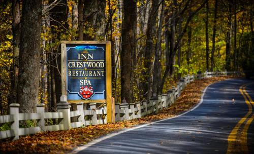 a sign on the side of a road at Inn at Crestwood in Boone