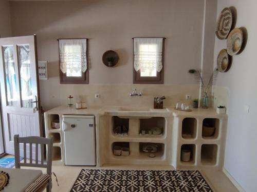 a kitchen with a sink and a counter at Pallos studio in Órmos Koumaíïkon