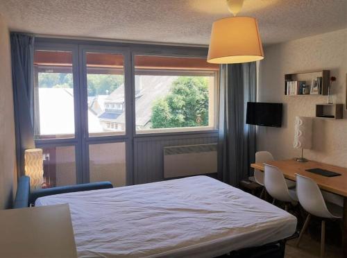 En eller flere senge i et værelse på appartement 4personnes à saint lary soulan