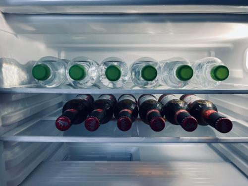 a refrigerator filled with lots of bottles of wine at ne-doma in Chomutov