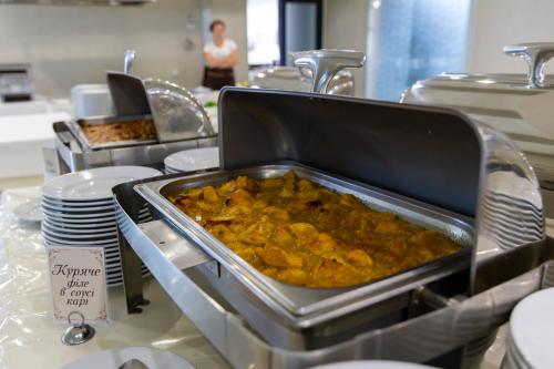 a buffet of food on a table in a restaurant at Truskavets 365 Hotel in Truskavets