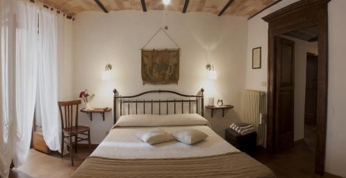 a bedroom with a bed with two pillows on it at Il Tomolo in Agnone