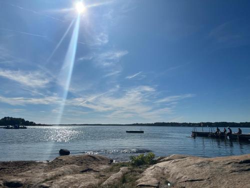 people are on a dock on a lake at Villa Bergåsa in Karlskrona