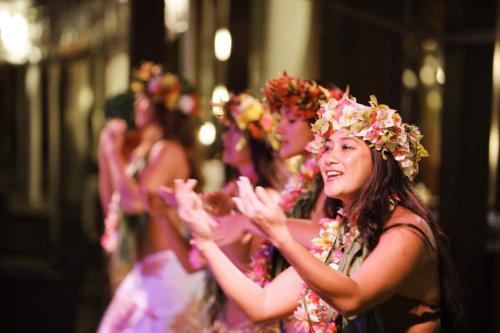 a group of women wearing flower wreaths at Sofitel Kia Ora Moorea Beach Resort in Maharepa