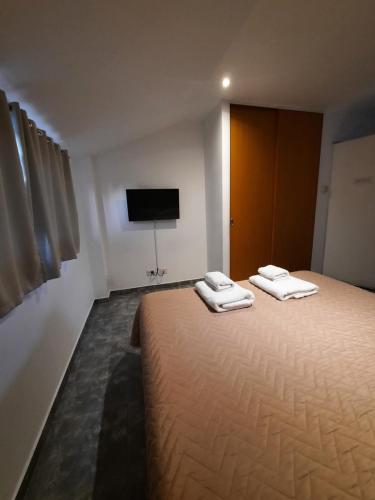 Una cama o camas en una habitación de DAT Amancay