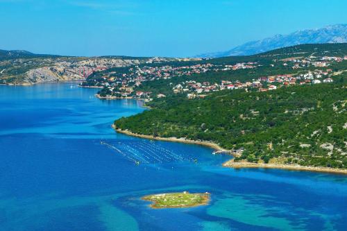 an island in the middle of a large body of water at Apartments with parking space Maslenica, Novigrad - 11089 in Maslenica