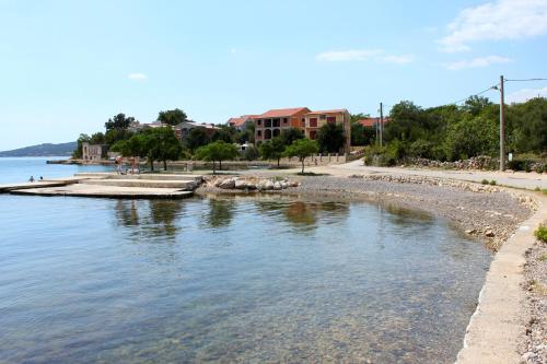 a body of water with a bunch of animals in it at Apartments with a parking space Maslenica, Novigrad - 13405 in Jasenice