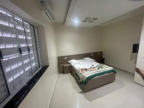Voodi või voodid majutusasutuse Hotel Aricanduva toas