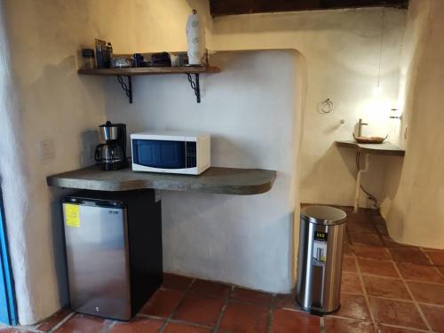 a kitchen with a counter with a microwave on it at The O'asis in La Ribera