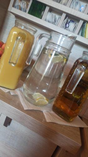 two jars of lemonade on a shelf in a refrigerator at Hotel AI Königshof in Berlin