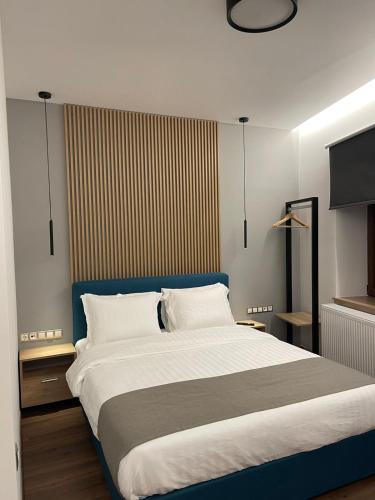 A bed or beds in a room at 11 Luxury apartments.