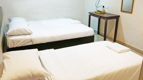 Кровать или кровати в номере Old Penang Hotel - Ampang Point