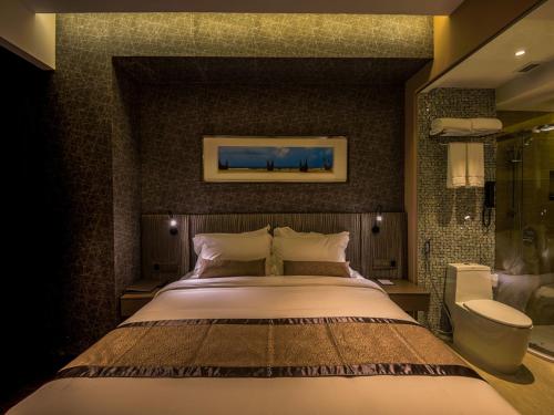 a bedroom with a large bed in a room at Best Western Plus Maple Leaf in Dhaka