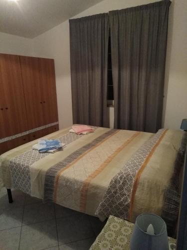 a bedroom with a large bed in a room at Villa Stella in Praia a Mare
