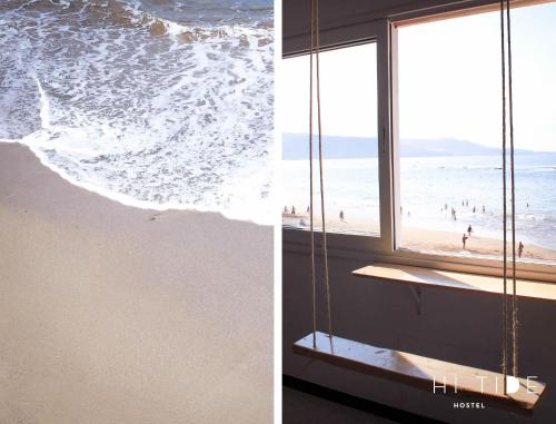 a window with a view of the beach and the ocean at Surf House Gran Canaria in Las Palmas de Gran Canaria