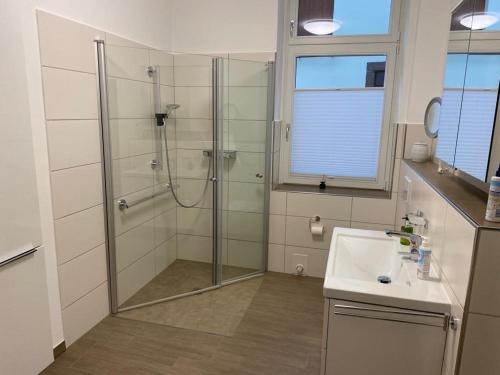 a bathroom with a shower and a sink at Apartment Van Eß Hof - Altstadt Warburg in Warburg